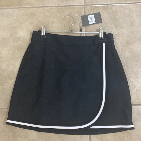 GFore black skull and pinstripe skort